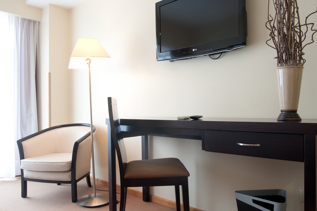 Guests enjoy an in-room desk at Hotel Oslo in Coimbra Portugal